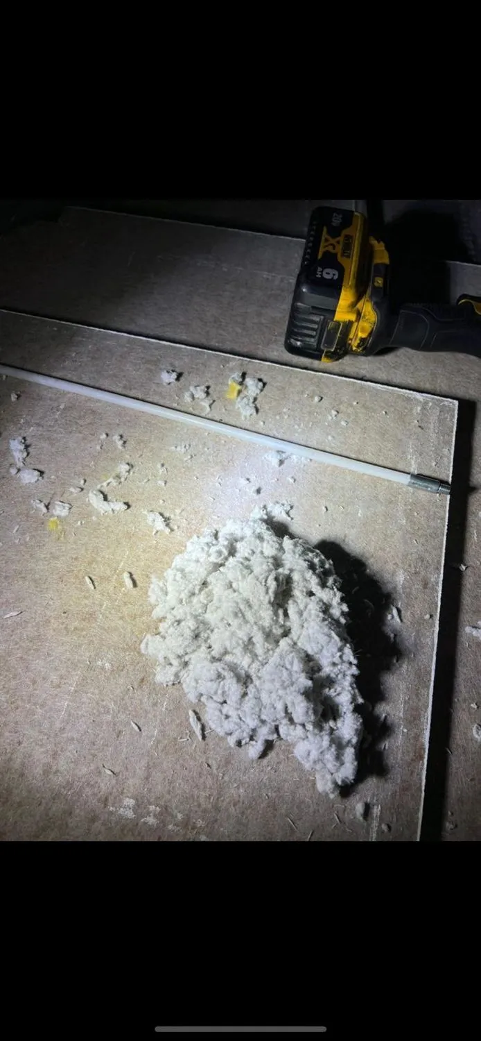 Lint pile removed from dryer vent with power drill
