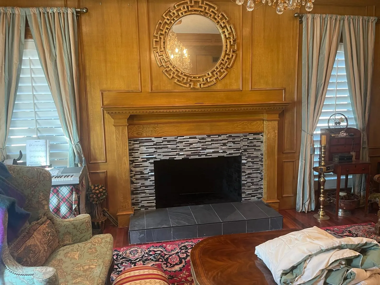 New stacked stone veneer being installed on fireplace surround